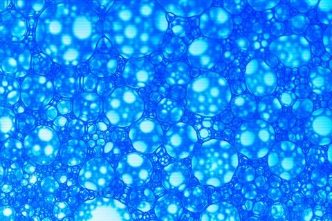A blue background with many small blue circles Stock Photos