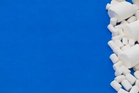 Blue background with marshmallows Stock Photos