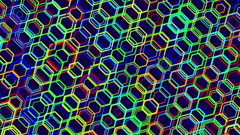On a blue background, a moving pattern of multi-colored hexagons. Animate a Stock Footage 279407671