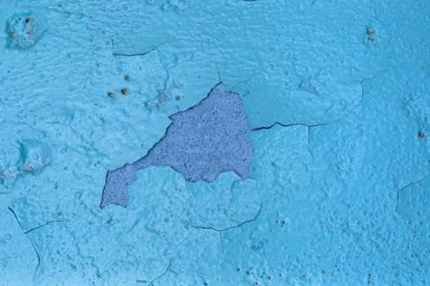 Blue background of an old wall painted with oil paint, cracked from old age,  Stock Photos