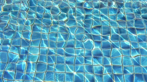 Blue background in pool with water reflections. Slow motion Stock Footage 124068056