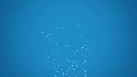 Blue background with soft floating clear bubbles Stock Photos