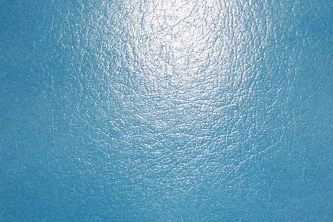 Blue background with structured leather with light Stock Photos