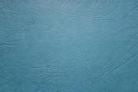 Blue background with structured leather Stock Photos