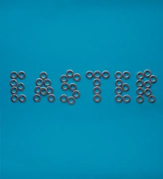 Blue background with text Easter made from washers Stock Photos