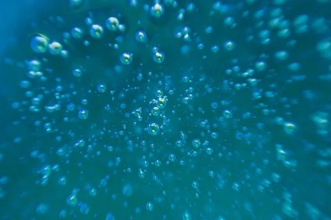 Blue background, texture with bubbles in some liquid. Stock Photos