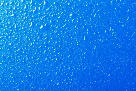 Blue background texture covered with water drops Stock Photos