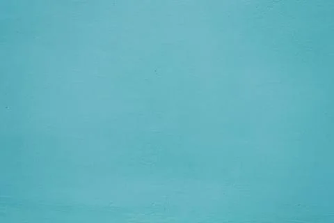 Blue background of the texture wall. Painted plaster close-up. Stock Photos