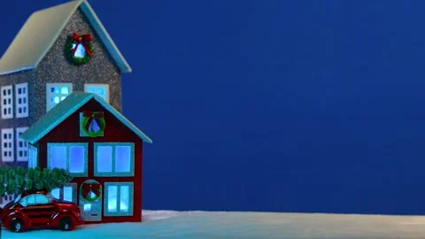 On a blue background there are decorated multi-colored houses and a red car Stock-Footage 294491879