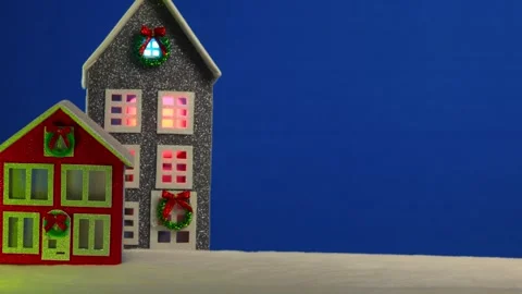 On a blue background there are two red and grey Christmas houses Stock Footage 294310811