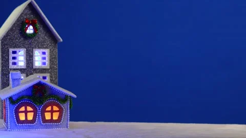 On a blue background there are two Christmas houses Stock Footage 294311013