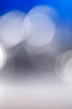 Blue background with white lighting round Stock Photos
