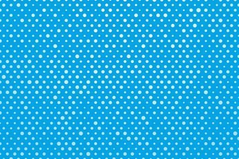 Blue background with white polka dots Illustrazione stock