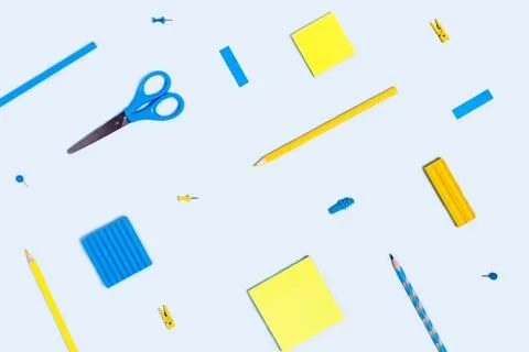 Blue background with writing materials. Stock Photos