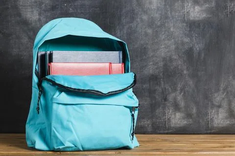 Blue backpack with textbooks. High quality photo Stock Photos