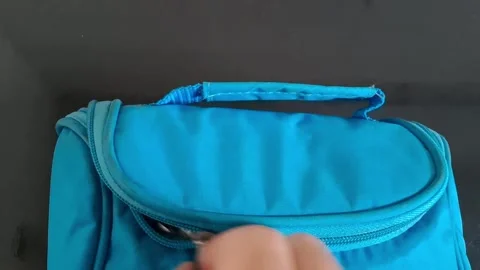 Blue backpack with zipper open for travel or school. Casual student or traveler Stock Footage 340480618