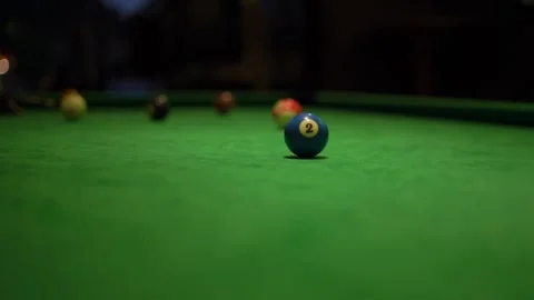 Blue ball with number two on pool table with green fabric Stock Footage 152075793