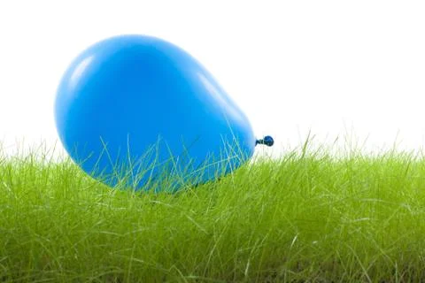 Blue balloon on the grass Stock Photos