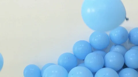 Blue Balloons Against Wall Stock Footage 95967618