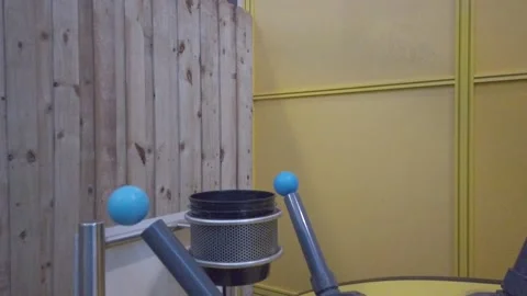 Blue Balls Float in Air Over Tubes Yellow Background Stock Footage 236481094