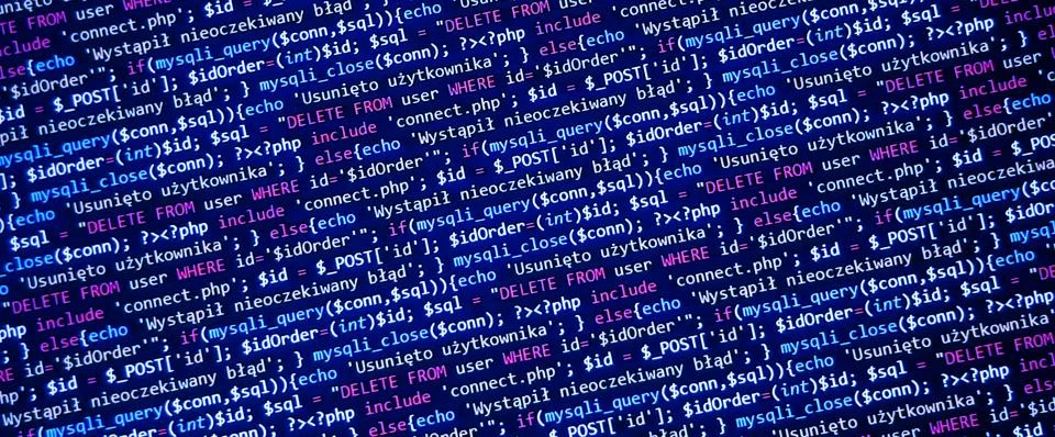 Blue banner with php language code on development monitor. Coding concept Stockfoto's