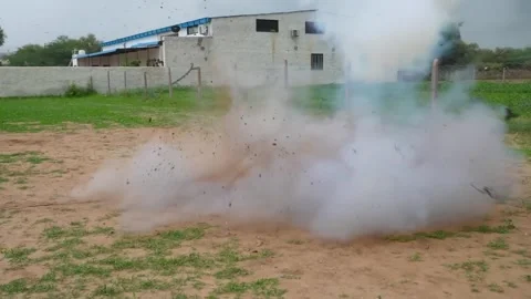 Blue barrel bomb explosion in slow motion showing fireball, shockwave Stock Footage 327909153