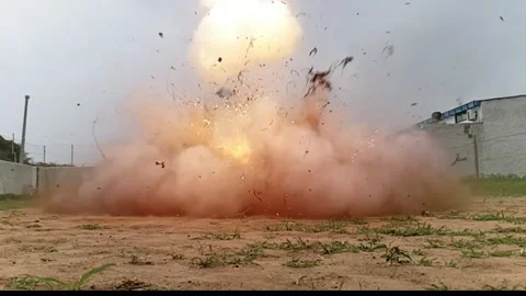 Blue barrel bomb explosion in slow motion showing fireball, shockwave Stock Footage 327909154