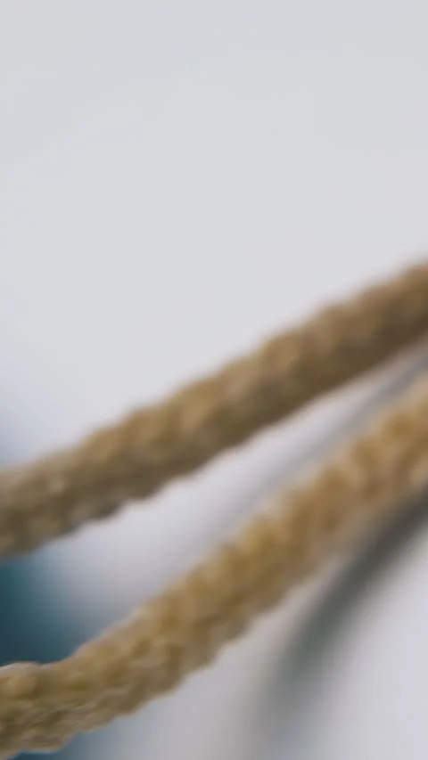 Blue basin plug with rope lies on clean white background Stock Footage 317384456