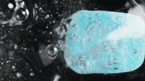 Blue Bath Bomb Dissolving Underwater, Surrounded by Bubbles and Effervescence, Stock Footage 283306068