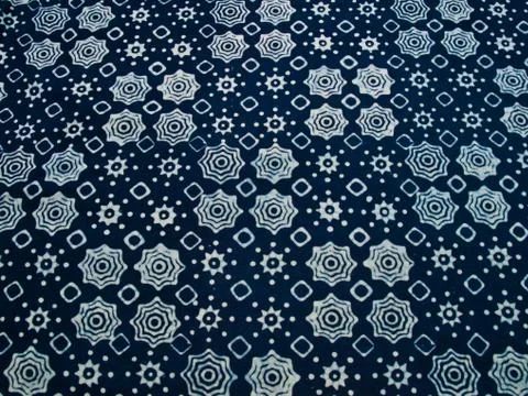 Blue batik fabric with repettition pattern as background from yogyakarta, ind Stock Photos