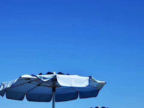 Blue beach umbrellas Photos