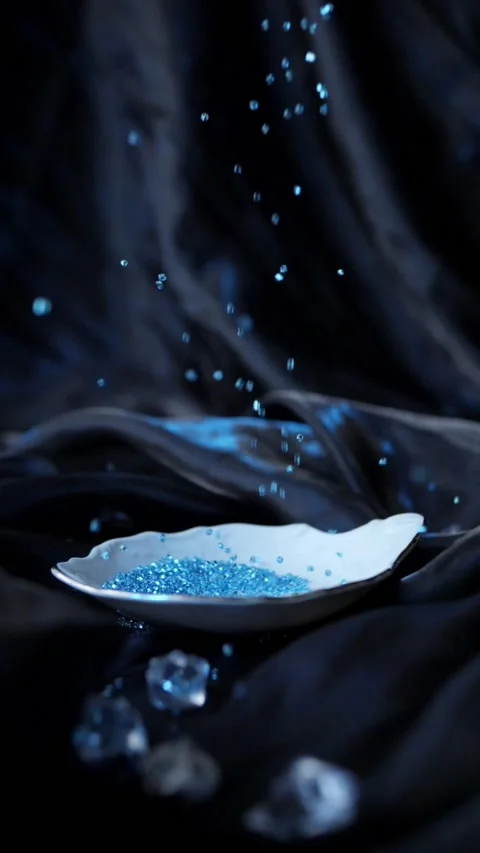 Blue beads fall slowly Stock Footage 235609065