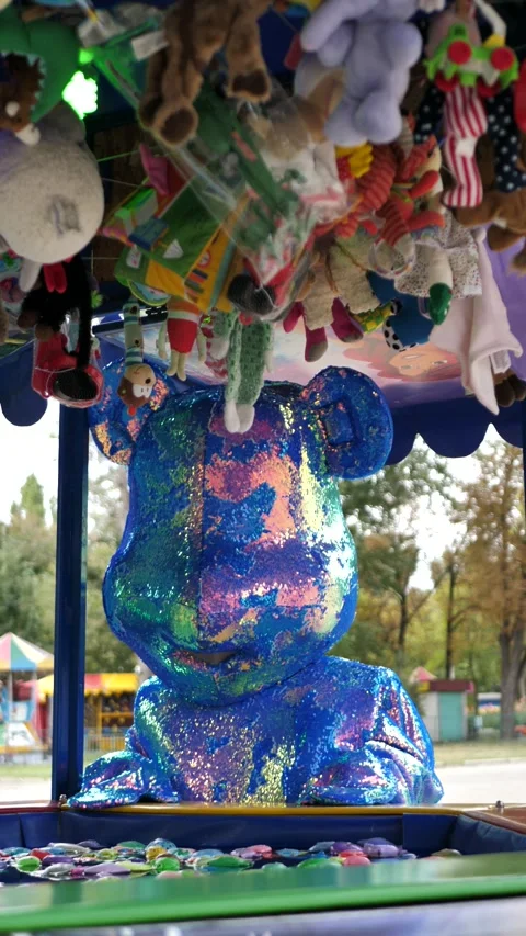 Blue bear mascot playing with plastic toy fish. toys for children Stock Footage 289674084