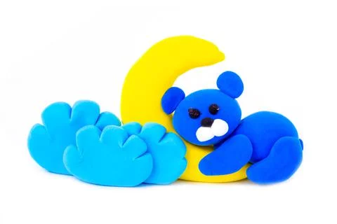 Blue bear, moon and clouds from air plasticine isolated on white background. Fotos Stock