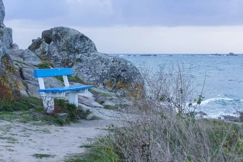 Blue Bench Facing the Atlantic Ocean in Brittany Stock Photos