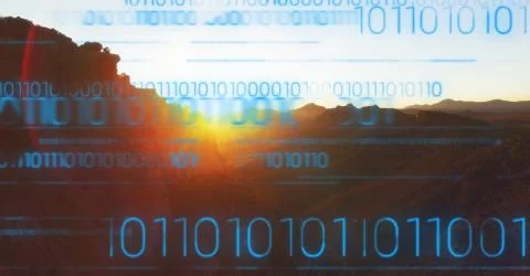 Blue binary code against mountain and sunset Stock Photos