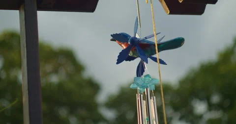 Blue Bird spinner and Wind Chime, Garden Scarecrow, hangs from trellis. Stock Footage 157026464