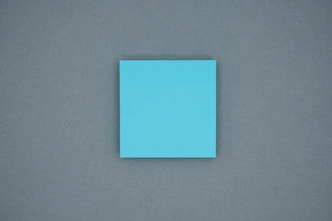 Blue blank sticky notes on gray background. Copy space for text, top view Stock Photos