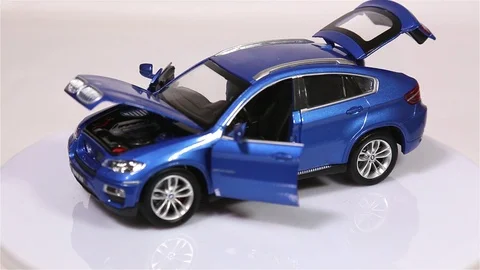 Blue BMW X6 scale model suv car with opened doors and hood Video stock 102021605