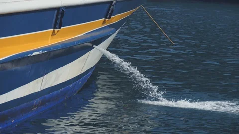 Blue board of a ship pumping water into the sea. Outcome hole with streaming Stock Footage 99003995