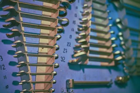 Blue board in ship's engine workshop with plent different types of tools: wre Stock Photos