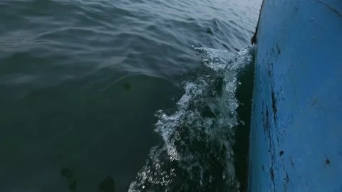 Blue boat hull cutting through the dark ocean water surface Stock-Footage 335270719