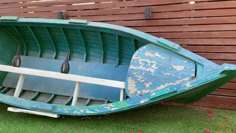 Blue boat keep in wall of park restaurant Stock Footage 154163747