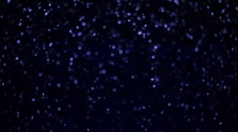 Blue bokeh texture background abstract. Sparkling dust particles for Christmas Stock Photos