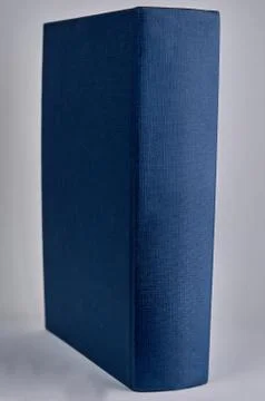 Blue book on white background with copyspace Stock Photos