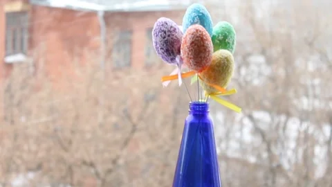 Blue bottle home decor with snowing backspace easter egg Stock Footage 170077352