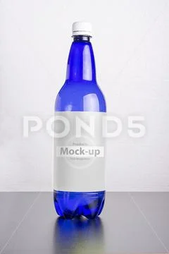 Blue bottle with label on table surface mock-up series PSD Template
