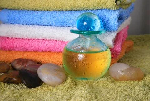 Blue bottle with massage oil Stock Photos