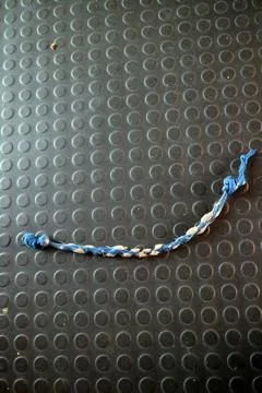 Blue Braided String on Textured Surface 스톡 사진