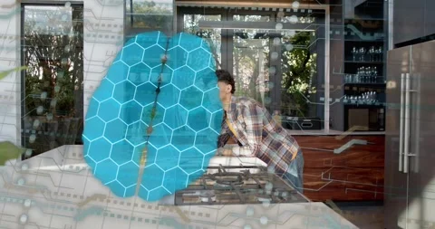 Blue brain hex appearing over counter, man leaning over range inspecting stove Stock Footage 321141230